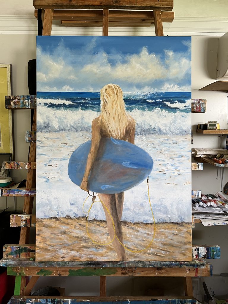 Painting on the easel of Blond Girl going surfing